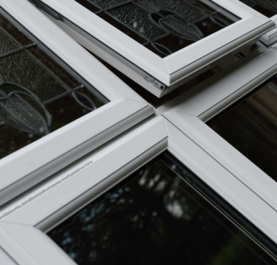 close up of white upvc casement window with decorative glass