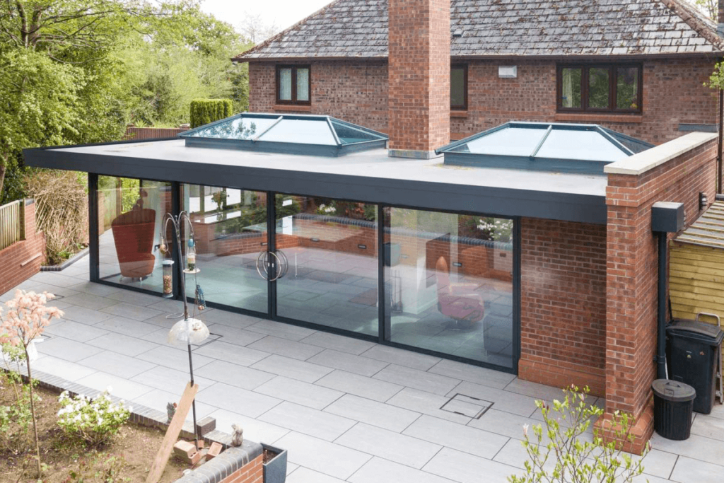 house extension with roof lanterns and sliding doors