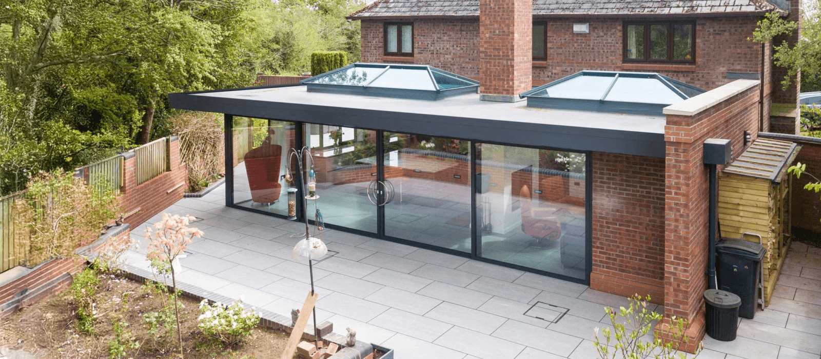house extension with roof lanterns and sliding doors
