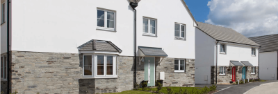 White uPVC casement windows fitted to semi-detached homes with part-render, part-stone exteriors and tiled roofs.