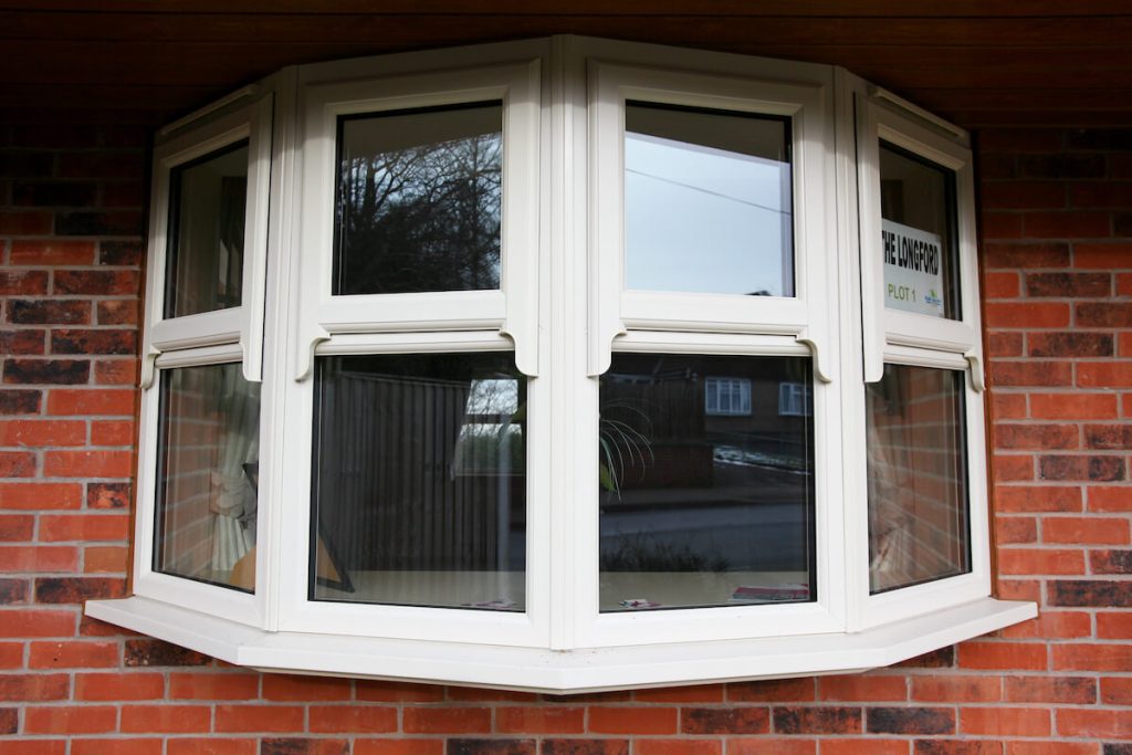white upvc bay windows with sash horns