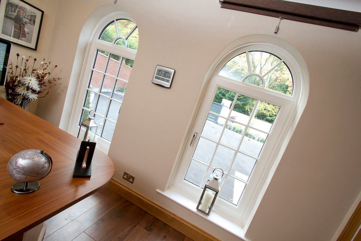 white upvc arched tilt and turn window