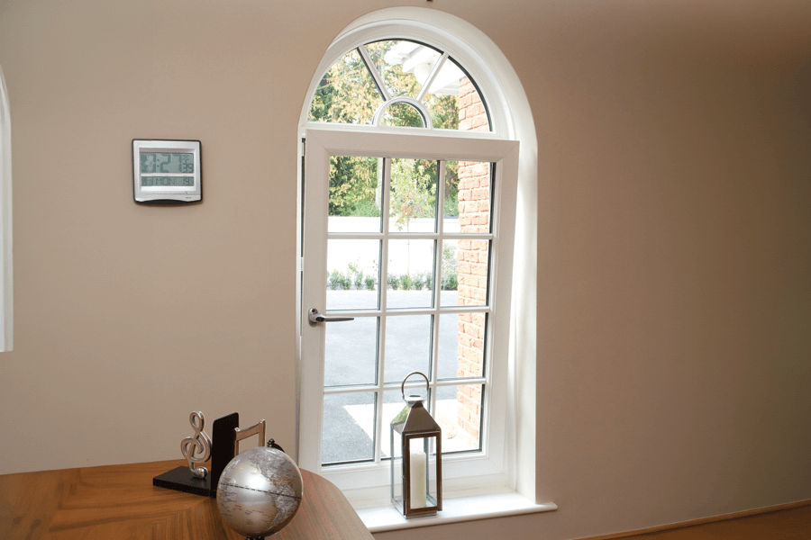 white upvc arched tilt and turn window
