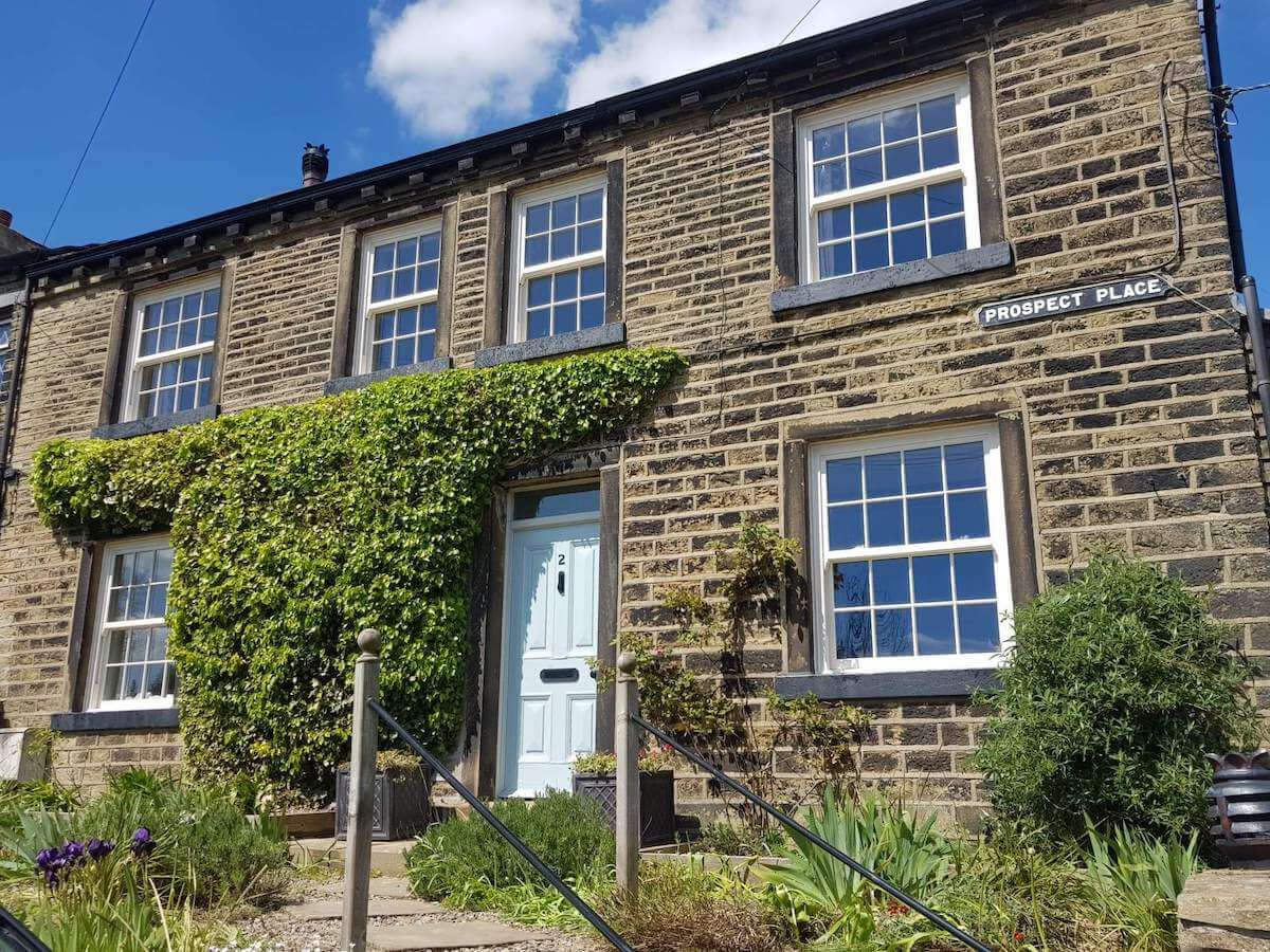 white sliding sash windows on cottage