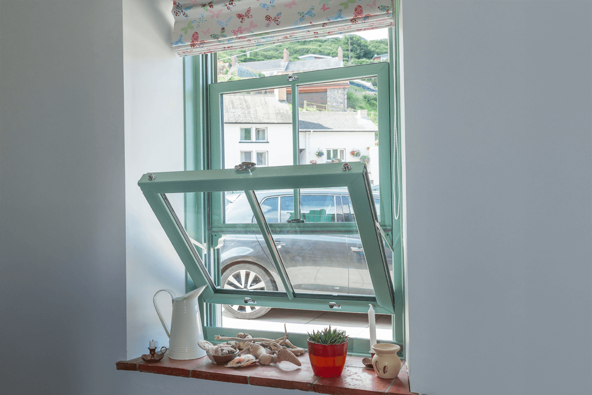 open green upvc sliding sash windows