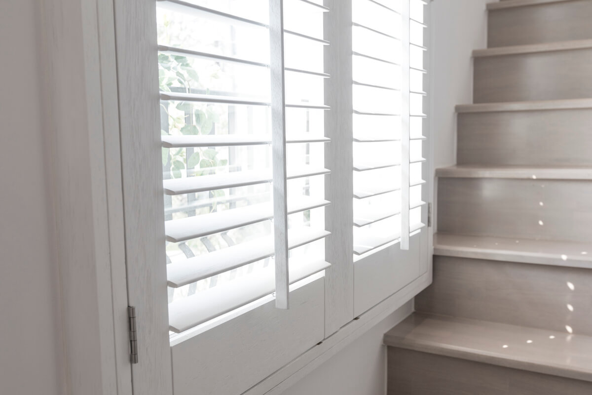 window shutters next to stairs