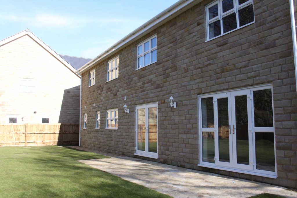 white upvc french doors leading to garden
