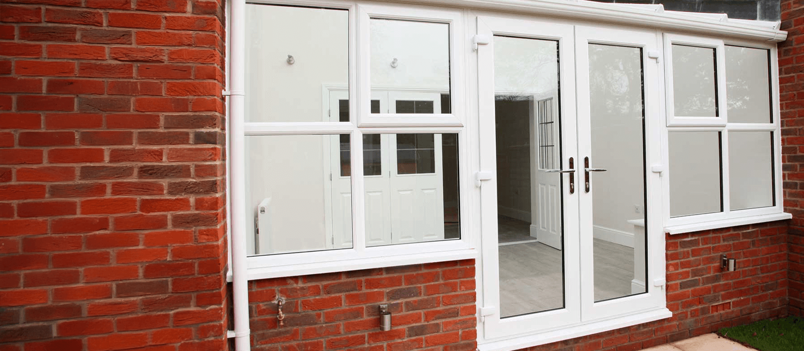 white upvc french doors in conservatory