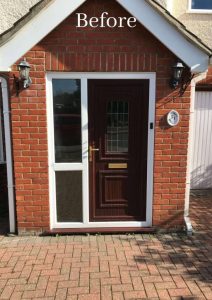 An outdated composite front door in Essex with a single glass panel, due for replacement to improve security and energy efficiency.