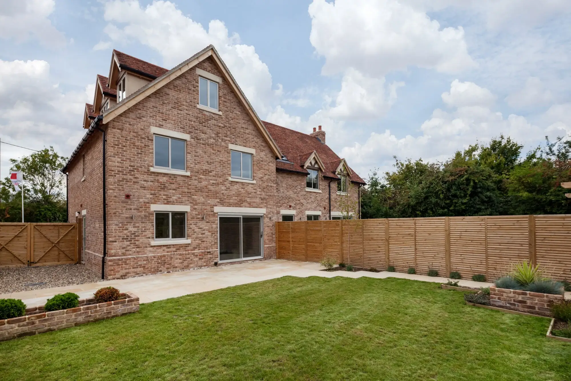 A modern brick home featuring ultra-slim aluminium windows with a sleek, energy-efficient design.