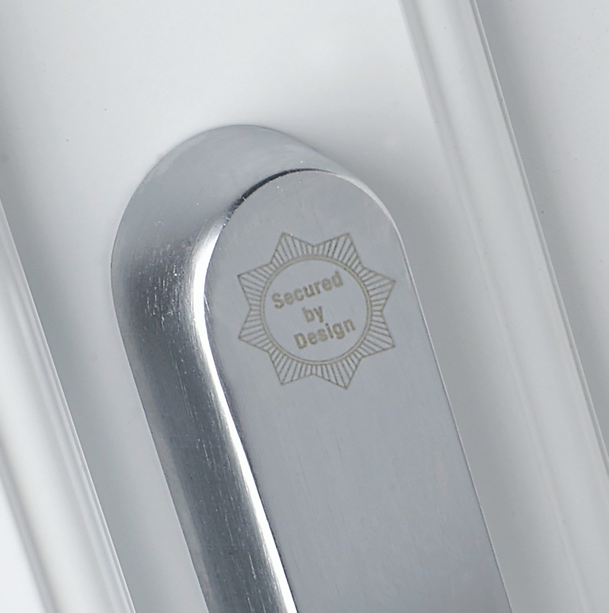 Close-up of a Secured by Design accredited aluminium window lock, showcasing its robust security features.